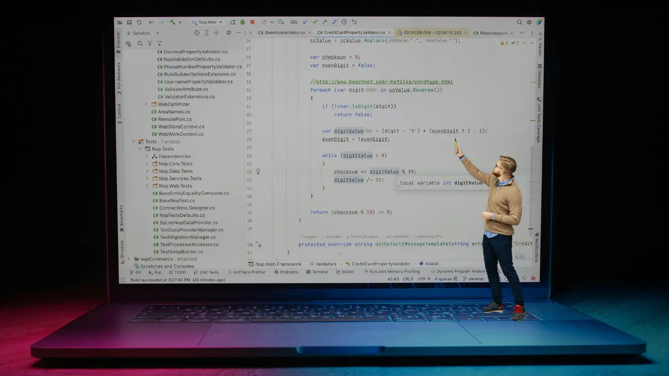 Student learning programming on a laptop with code on screen and a simple workspace setup